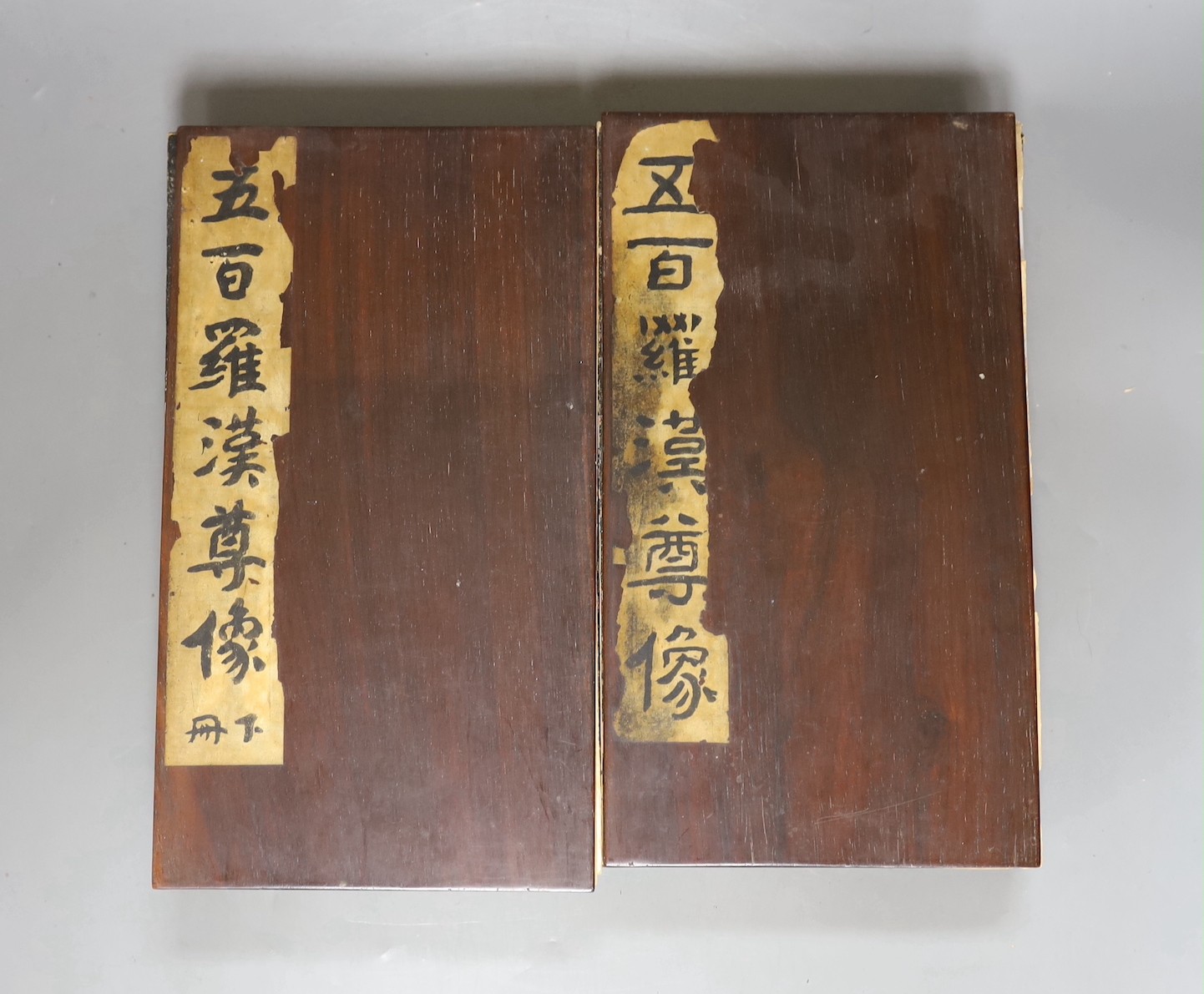 Two Chinese illustrated books Five Hundred Luohan, late Qing dynasty, hongmu covers (detached)